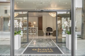 Enter the Akali Hotel, where a clear view into the interior sets the tone for a welcoming atmosphere.