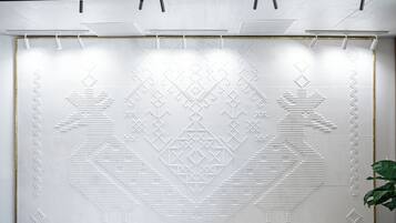 A wall with a geometric pattern, possibly a decorative wall or artwork.