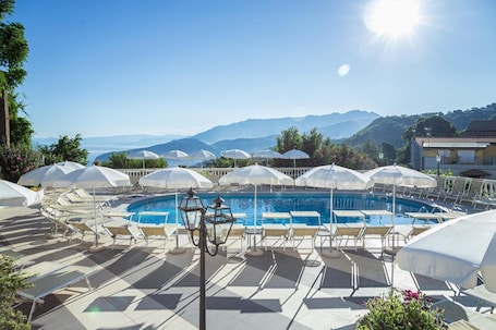 Outdoor pool, open 9:00 AM to 6:00 PM, pool umbrellas, sun loungers