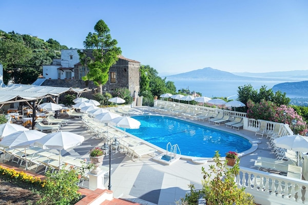 Outdoor pool, open 9:00 AM to 6:00 PM, pool umbrellas, sun loungers