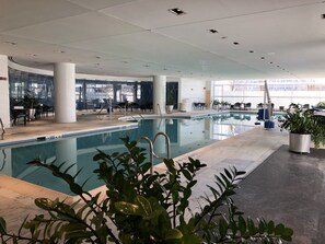 Indoor pool, open 6:00 AM to 11:00 PM, pool loungers