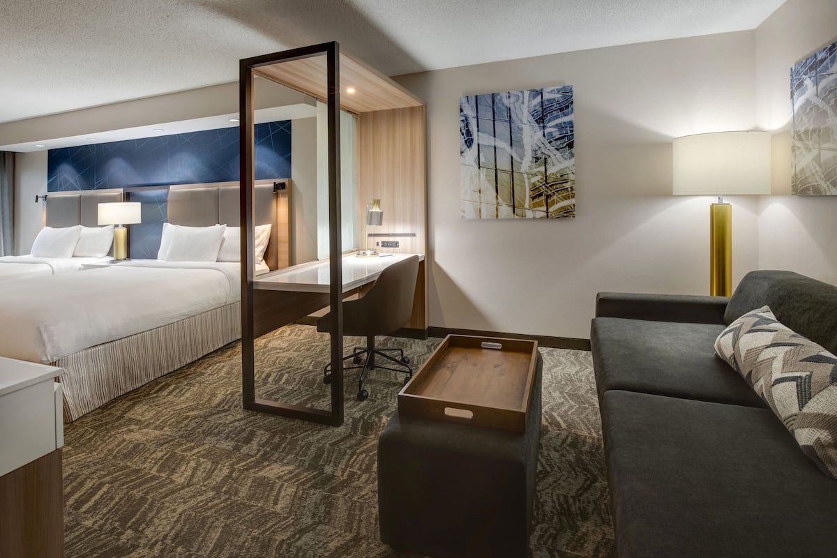 Premium bedding, desk, laptop workspace, blackout curtains