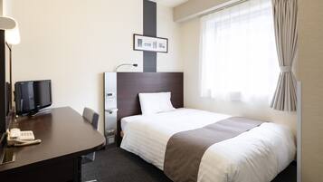 Roupas de cama premium, escrivaninha, cortinas blackout