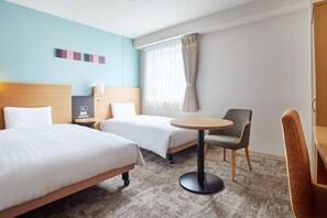 A hotel room with two beds, a round table, a chair, a nightstand, and a window with curtains. - Comfort Hotel Sendai East (Sendai)