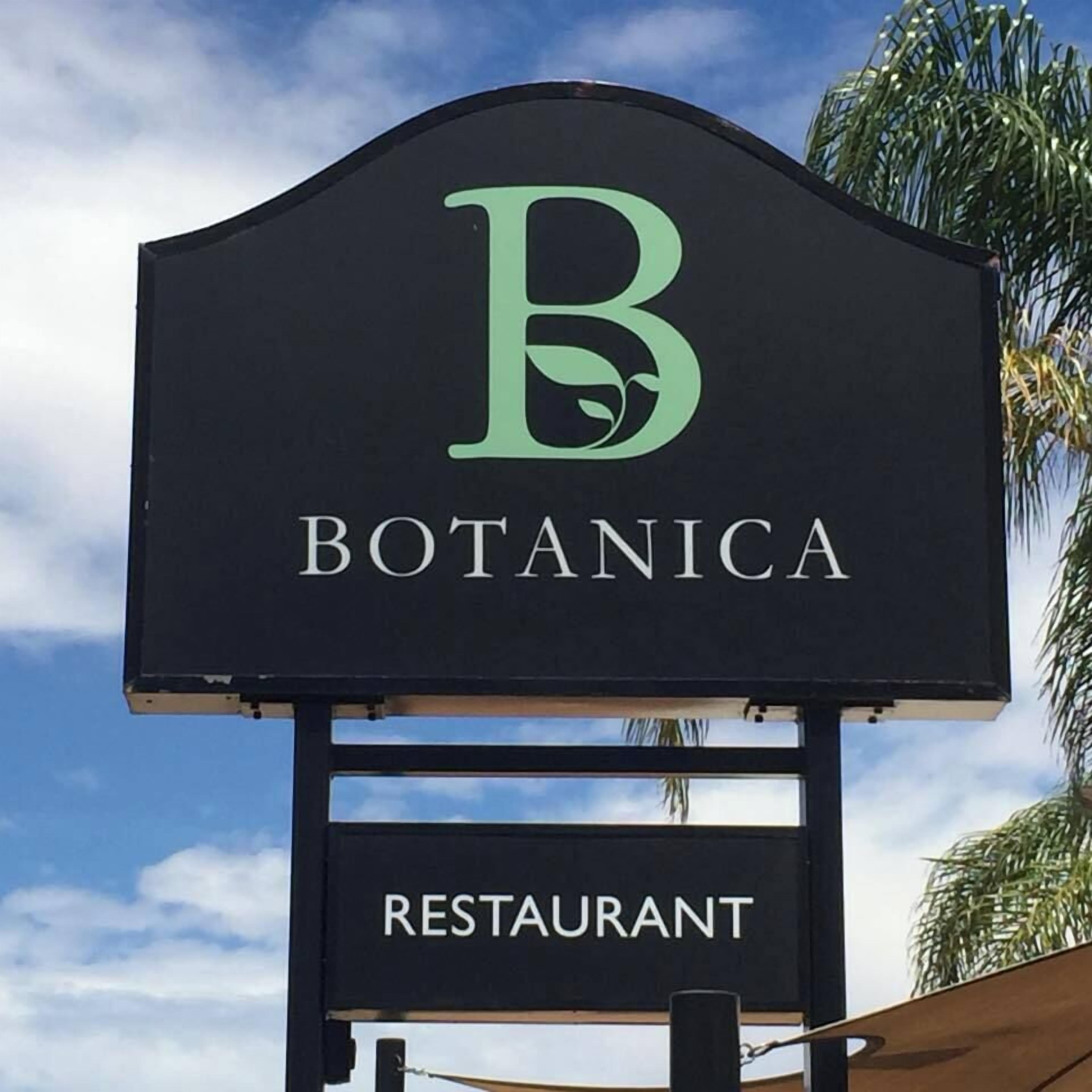 A sign for a restaurant named 'Botanica' with a large 'B' logo.