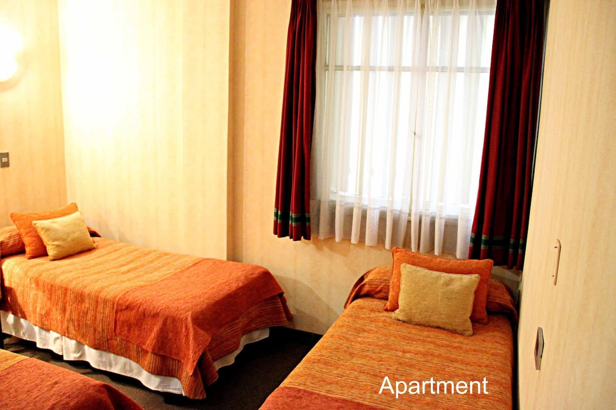 Desk, laptop workspace, WiFi (free), bed sheets