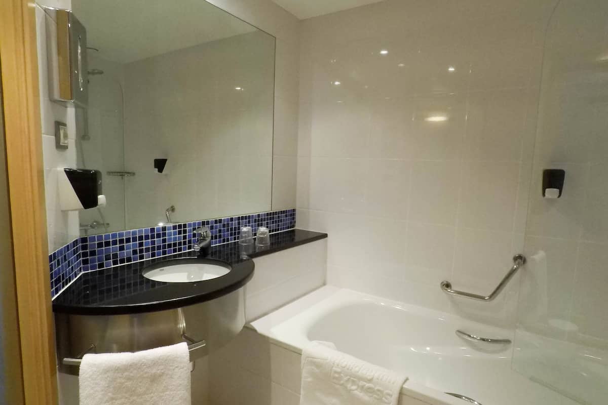 bathtub, hair dryer, bidet, towels