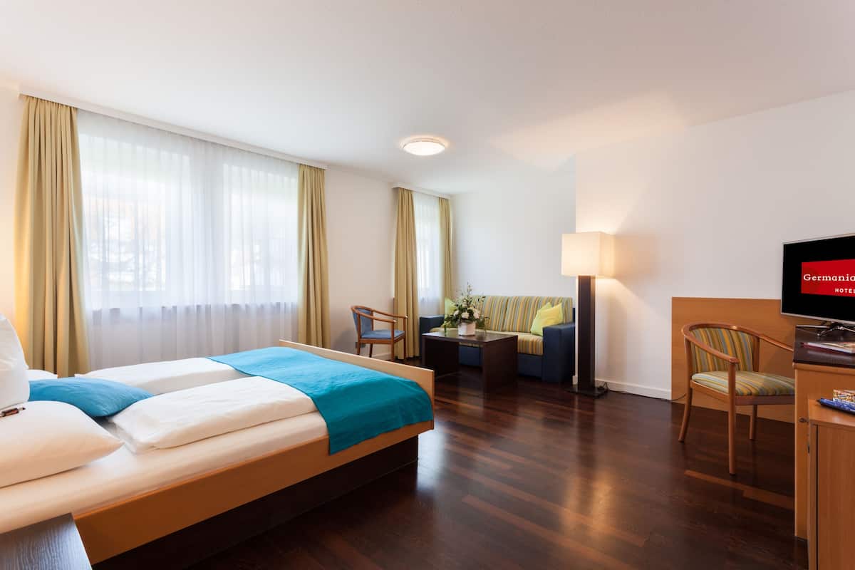 Suite junior | Ropa de cama de alta calidad y caja de seguridad en la habitación