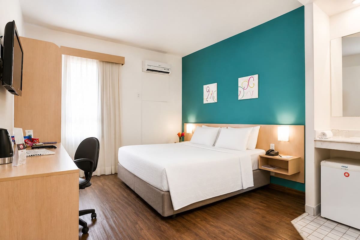 Superior Double Room | Minibar, in-room safe, desk, blackout drapes