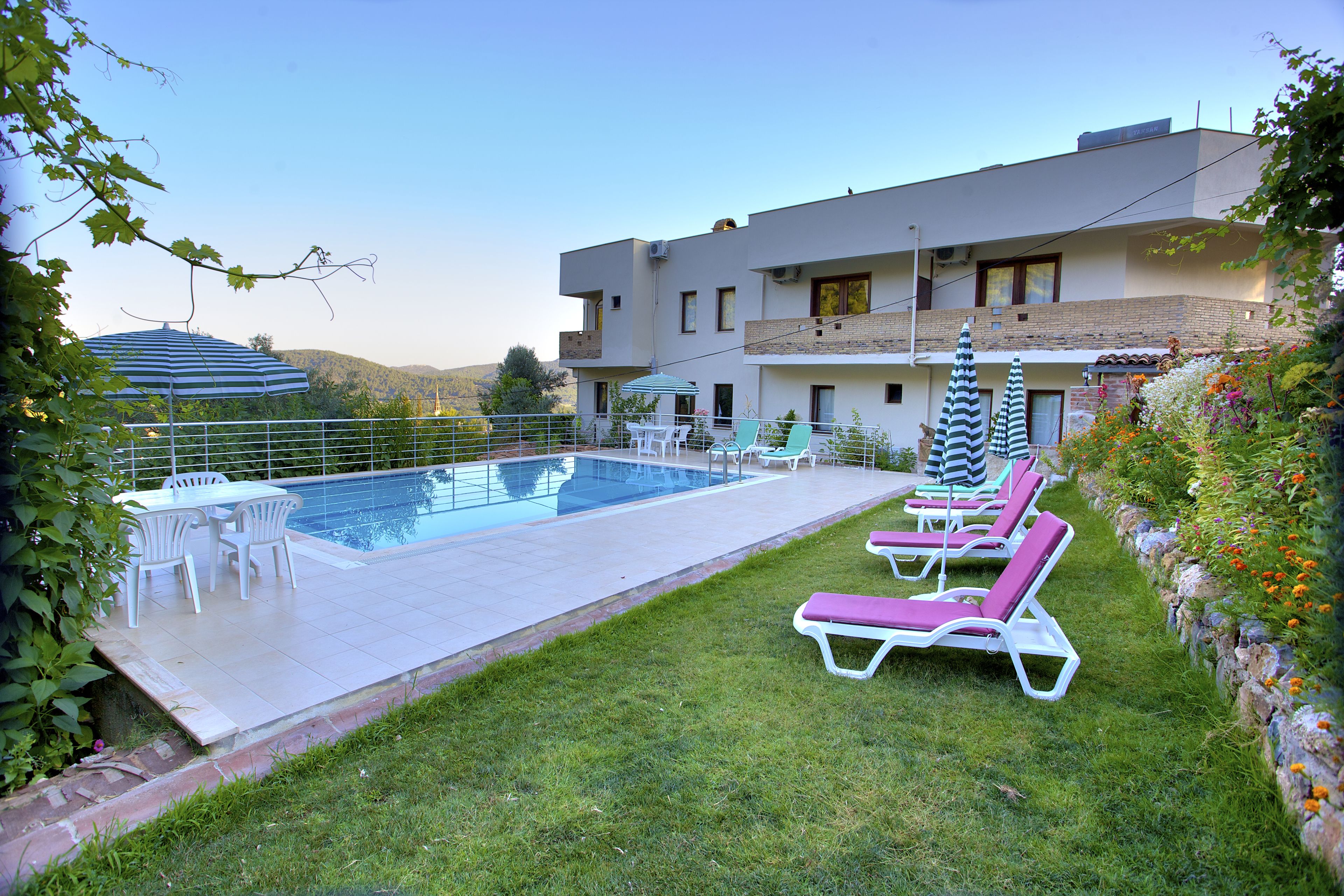 outdoor pool, pool umbrellas, pool loungers