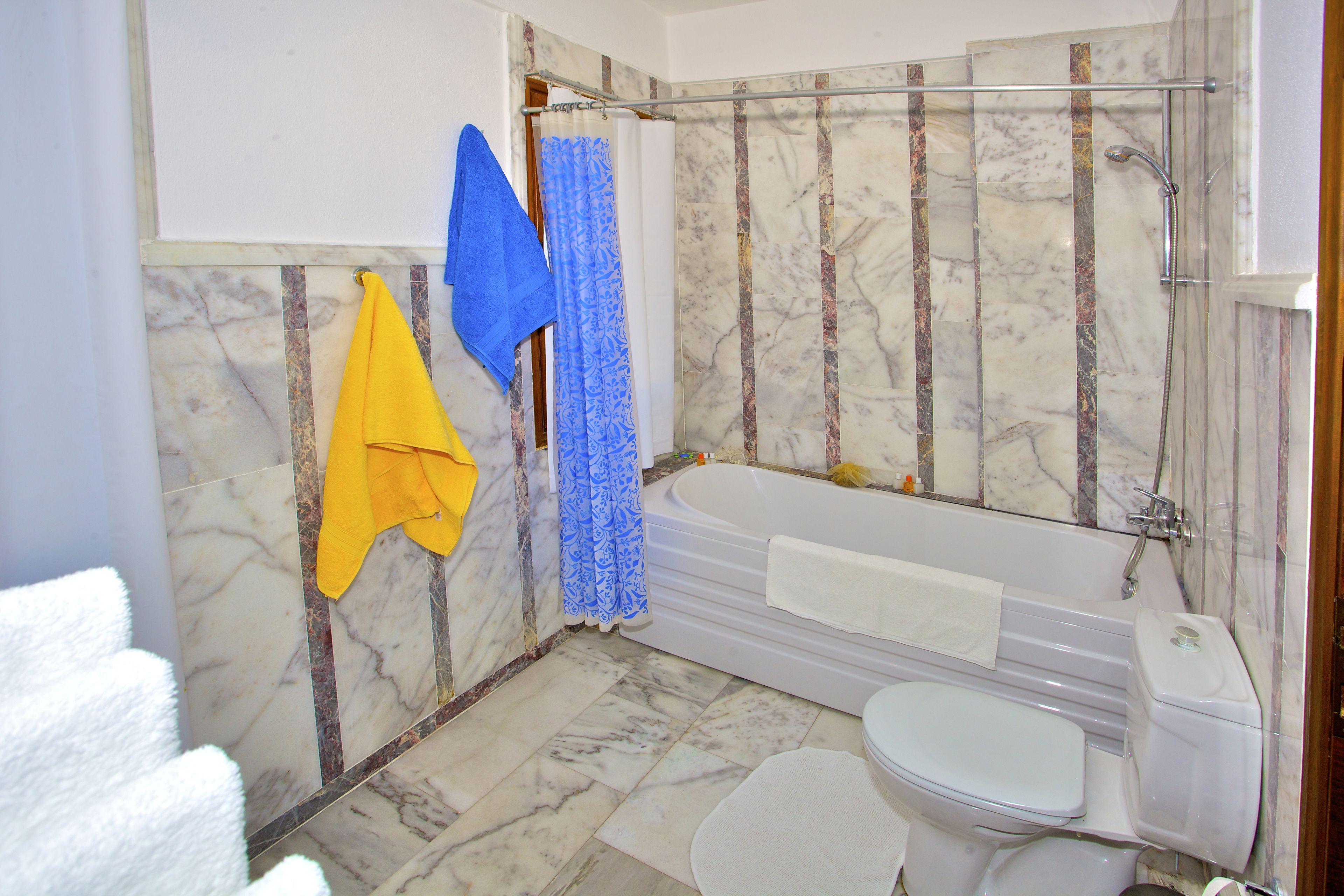 hair dryer, bathrobes, slippers, towels