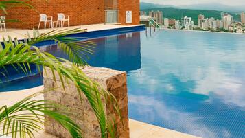 Outdoor pool, open 8:00 AM to 6:00 PM, pool umbrellas, pool loungers