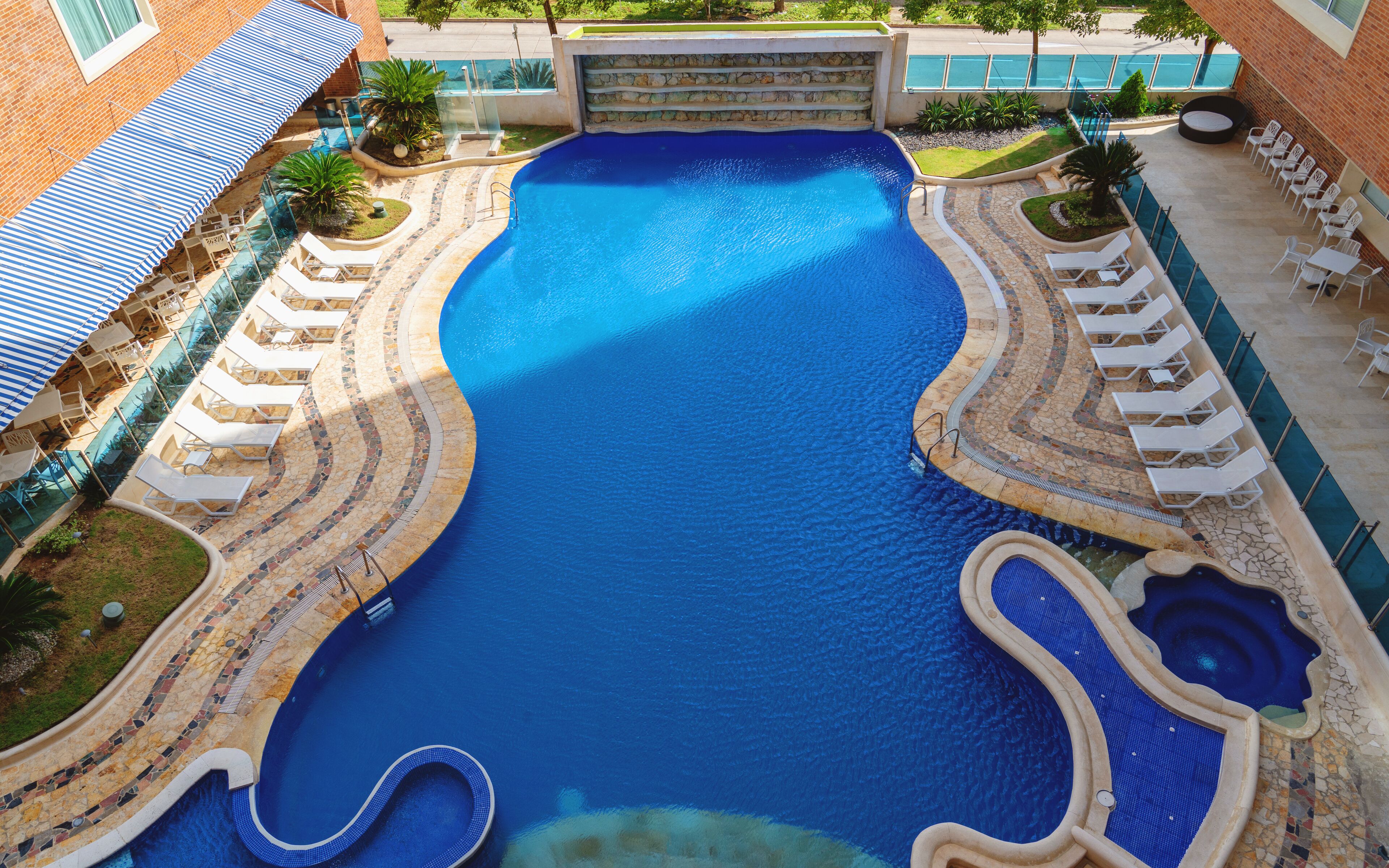 outdoor pool, open 8:00 am to 6:00 pm, pool umbrellas, pool loungers