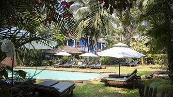 Outdoor pool, open 8 AM to 8 PM, pool umbrellas, pool loungers