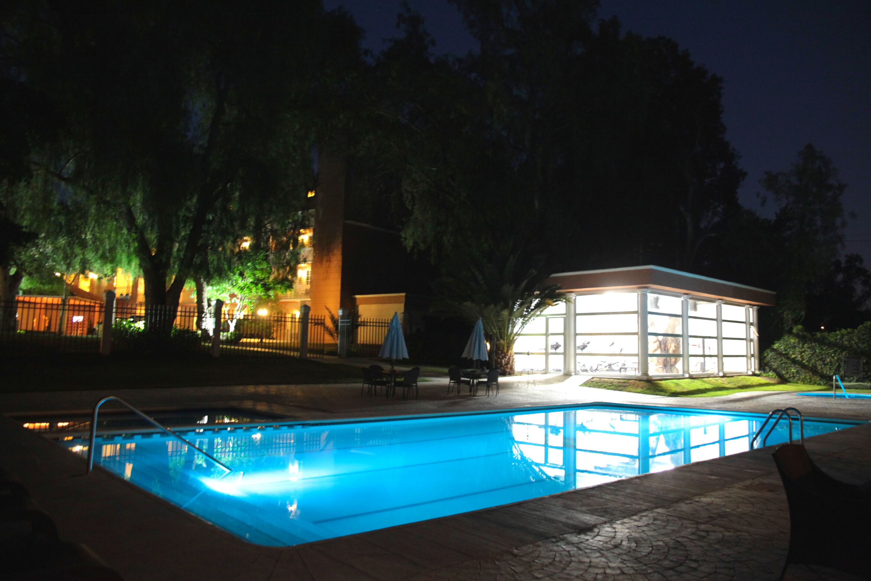 outdoor pool, open 10:00 am to 8:00 pm, pool umbrellas, pool loungers