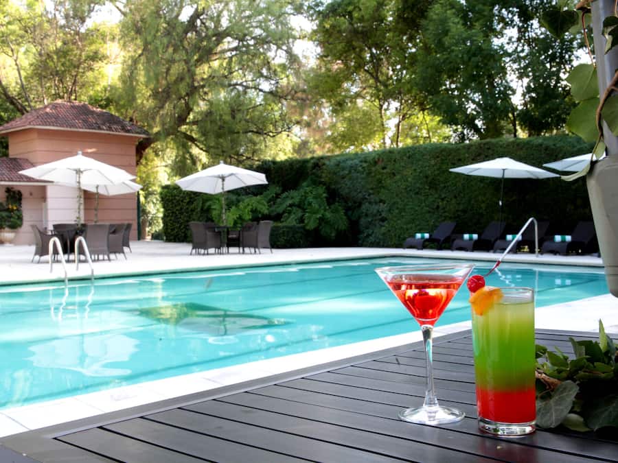 Outdoor pool, open 10:00 AM to 8:00 PM, pool umbrellas, pool loungers