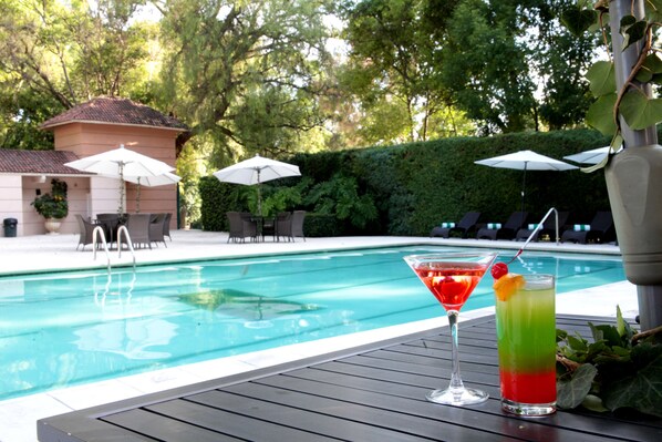 Outdoor pool, open 10:00 AM to 8:00 PM, pool umbrellas, pool loungers