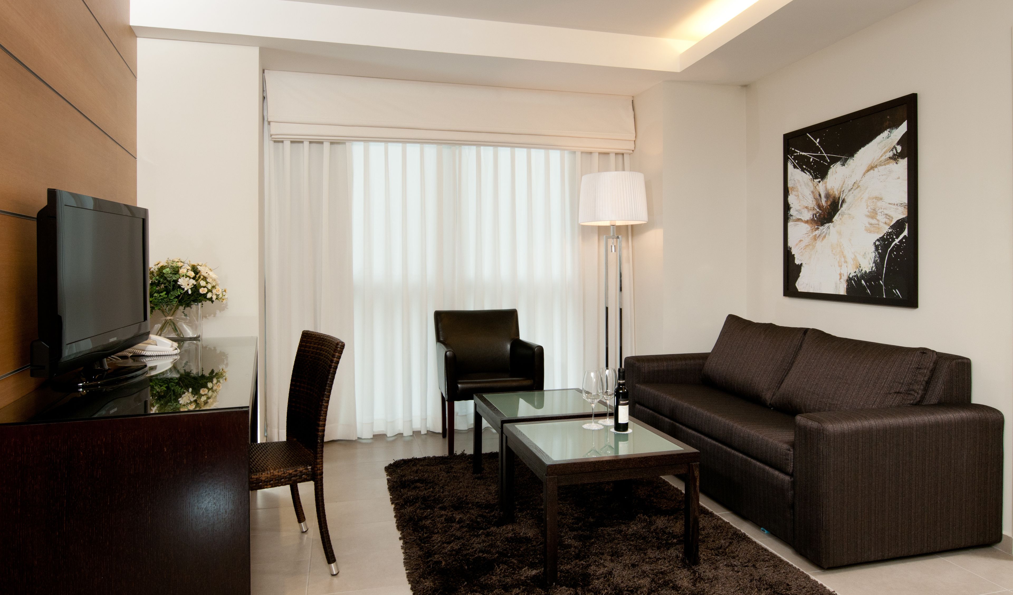 executive one bedroom suite with club lounge access | living room | 40-inch lcd tv with satellite channels, tv