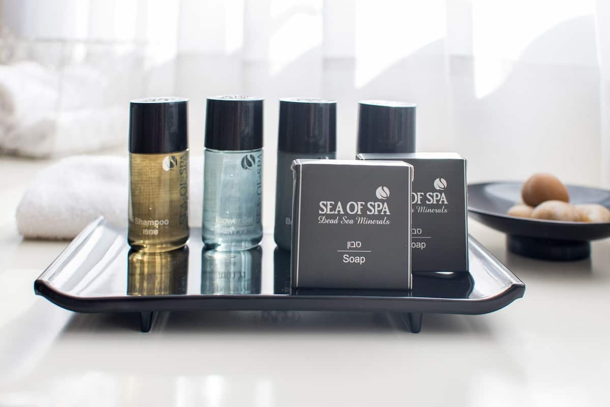 A tray with four bottles of Sea of Spa Dead Sea Minerals products and a box of soap.