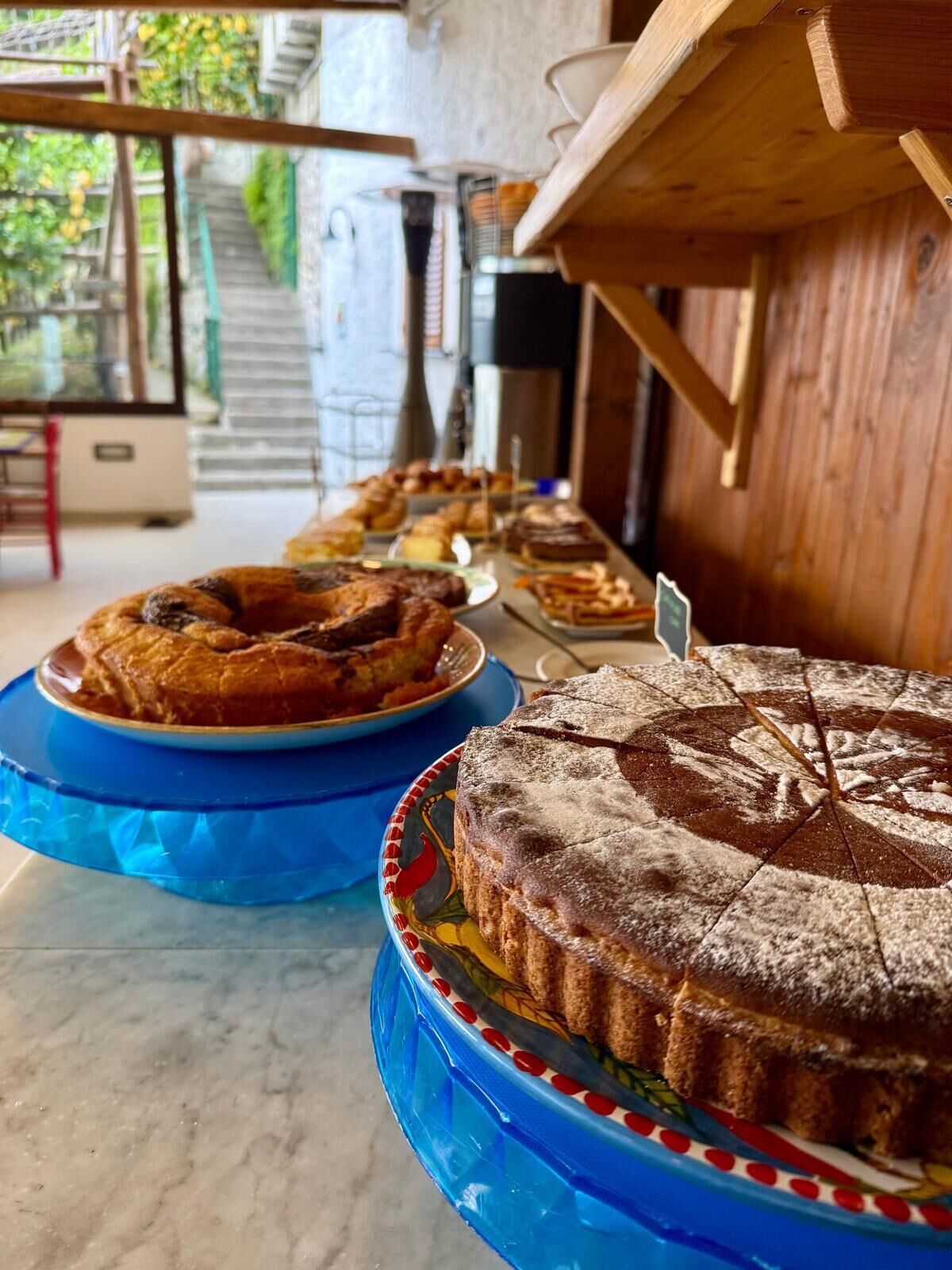 A bakery display with various baked goods.
