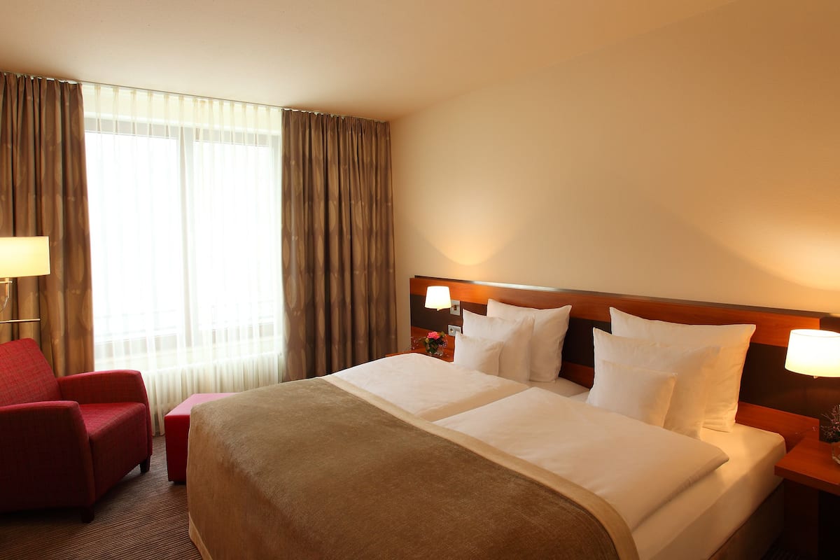 comfort room | hypo-allergenic bedding, desk, laptop workspace, blackout curtains