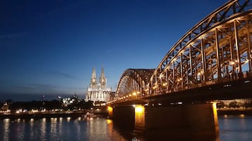 A bridge with a cathedral in the background.