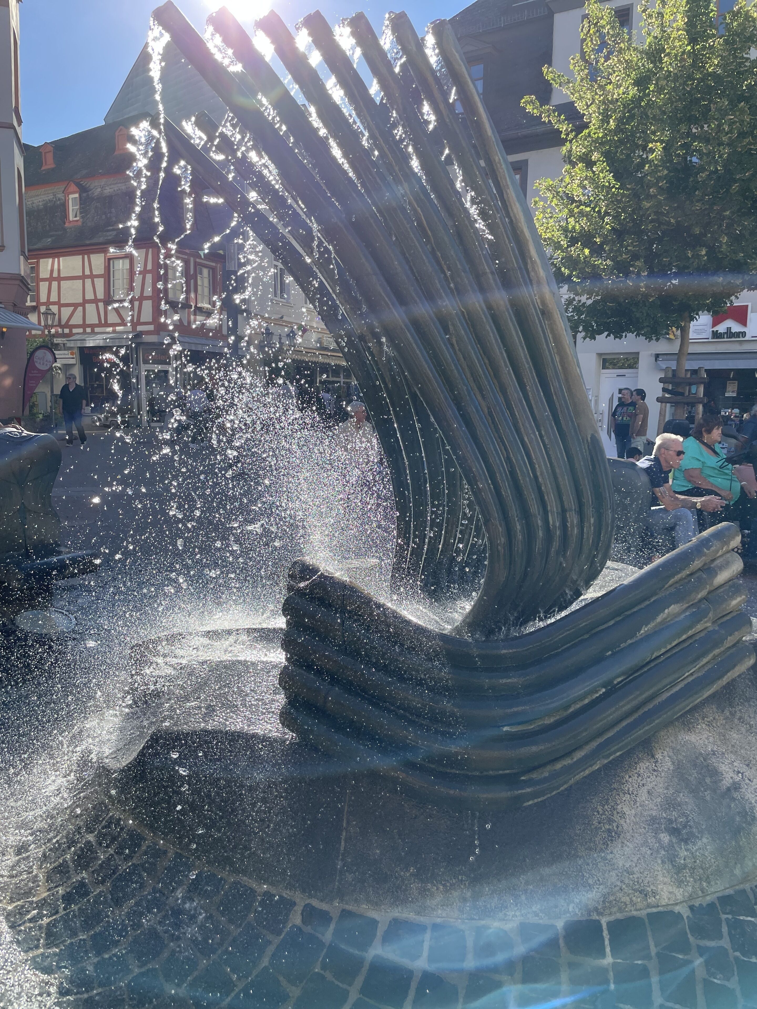 A fountain with water jets in a public square.