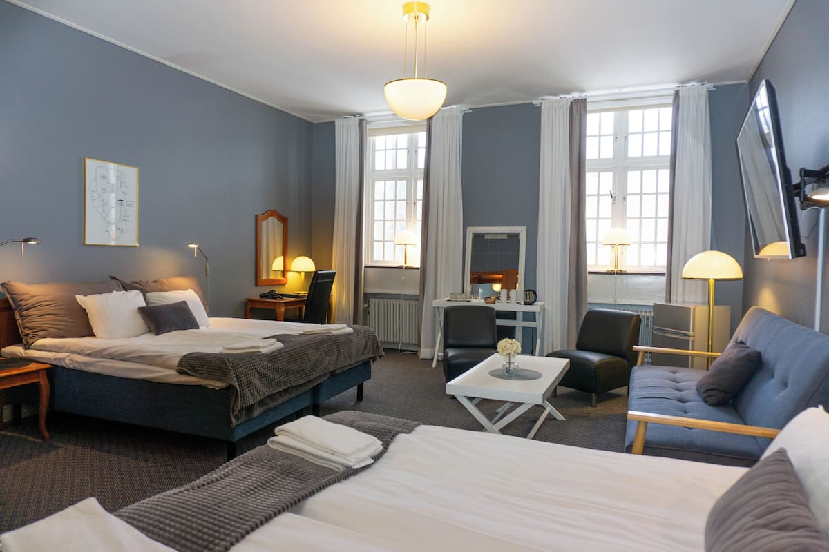 family room | desk, laptop workspace, iron/ironing board, free cots/infant beds