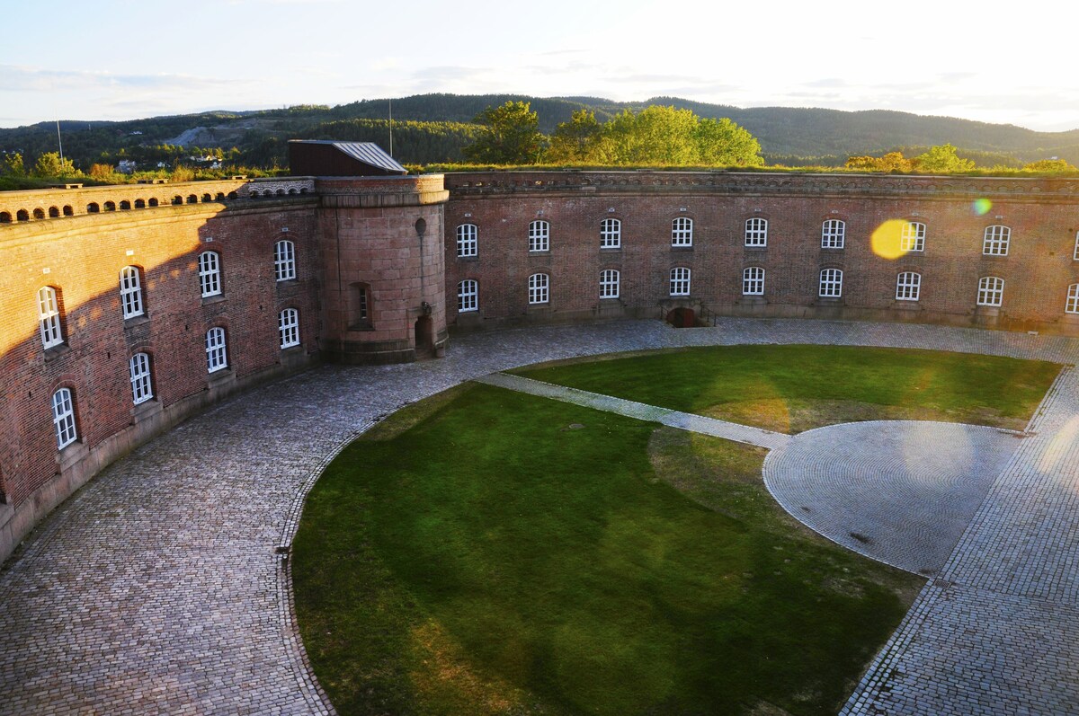 Brick castle in the shape of half a circle with a courtyard in the middle