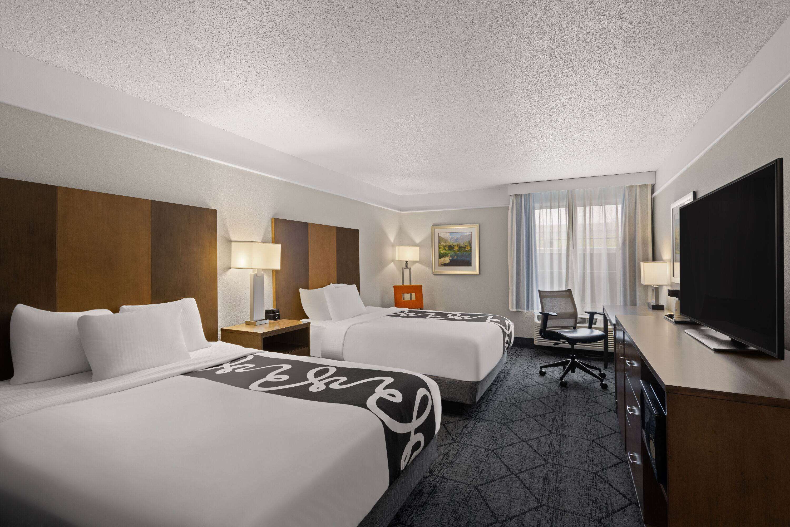 premium bedding, pillow-top beds, desk, blackout curtains