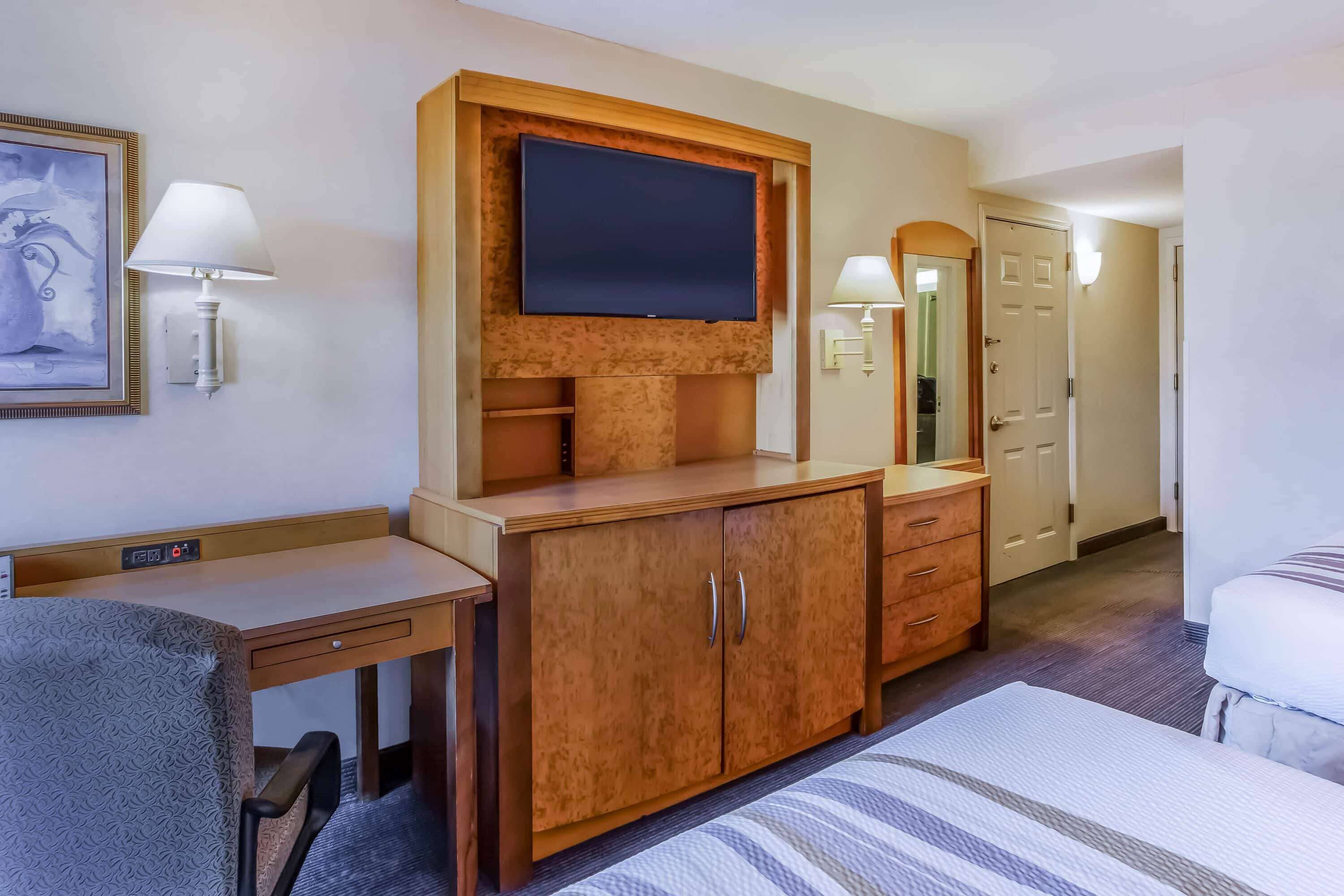 premium bedding, pillow-top beds, desk, blackout curtains