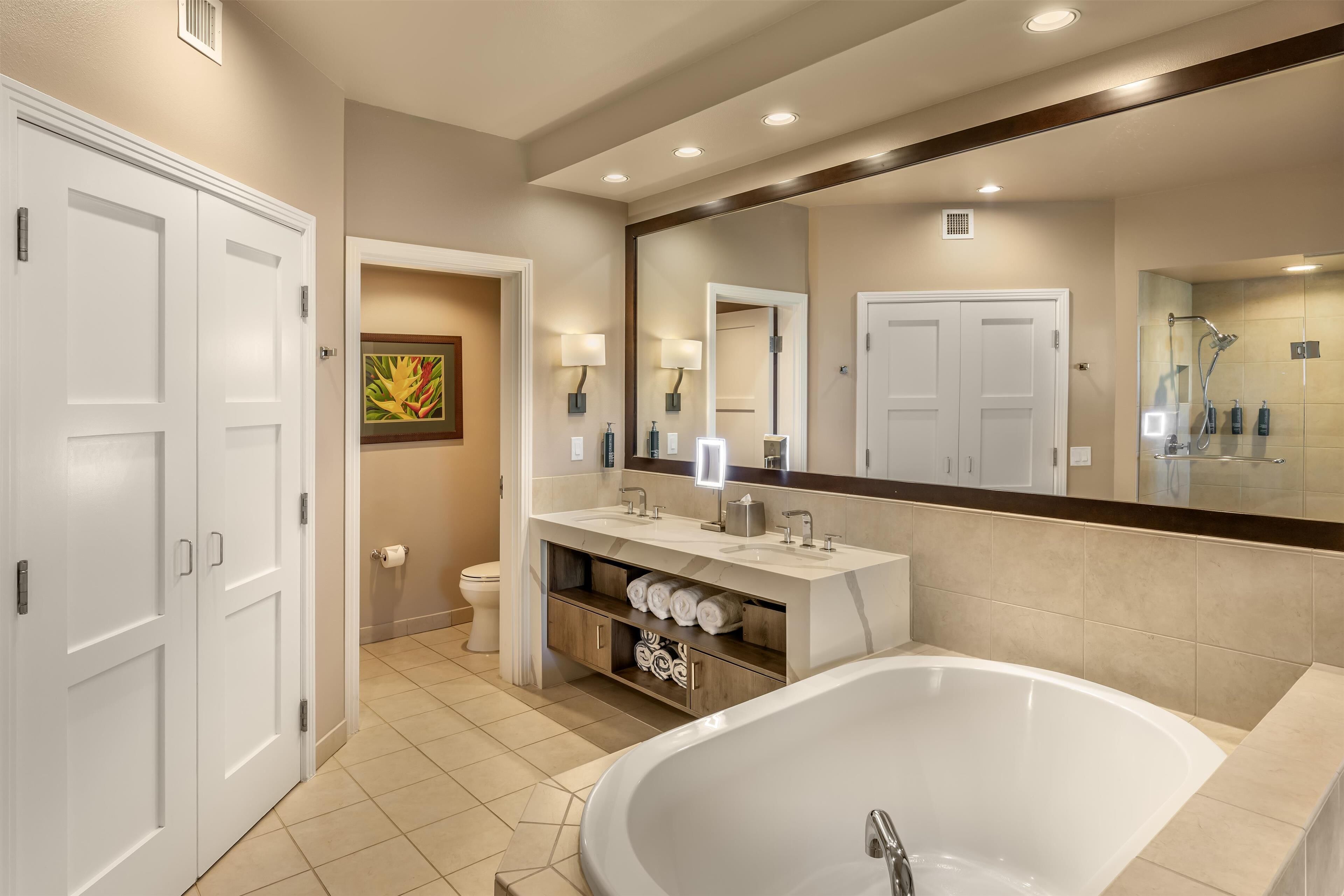 separate bathtub and shower, deep-soaking bathtub, designer toiletries