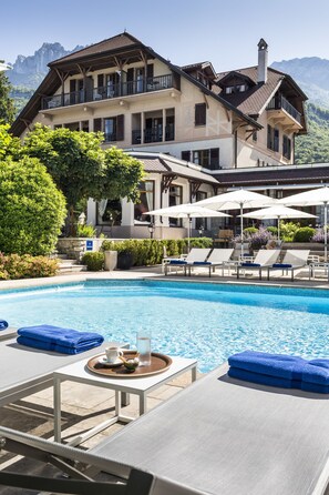 Outdoor pool, pool umbrellas, pool loungers