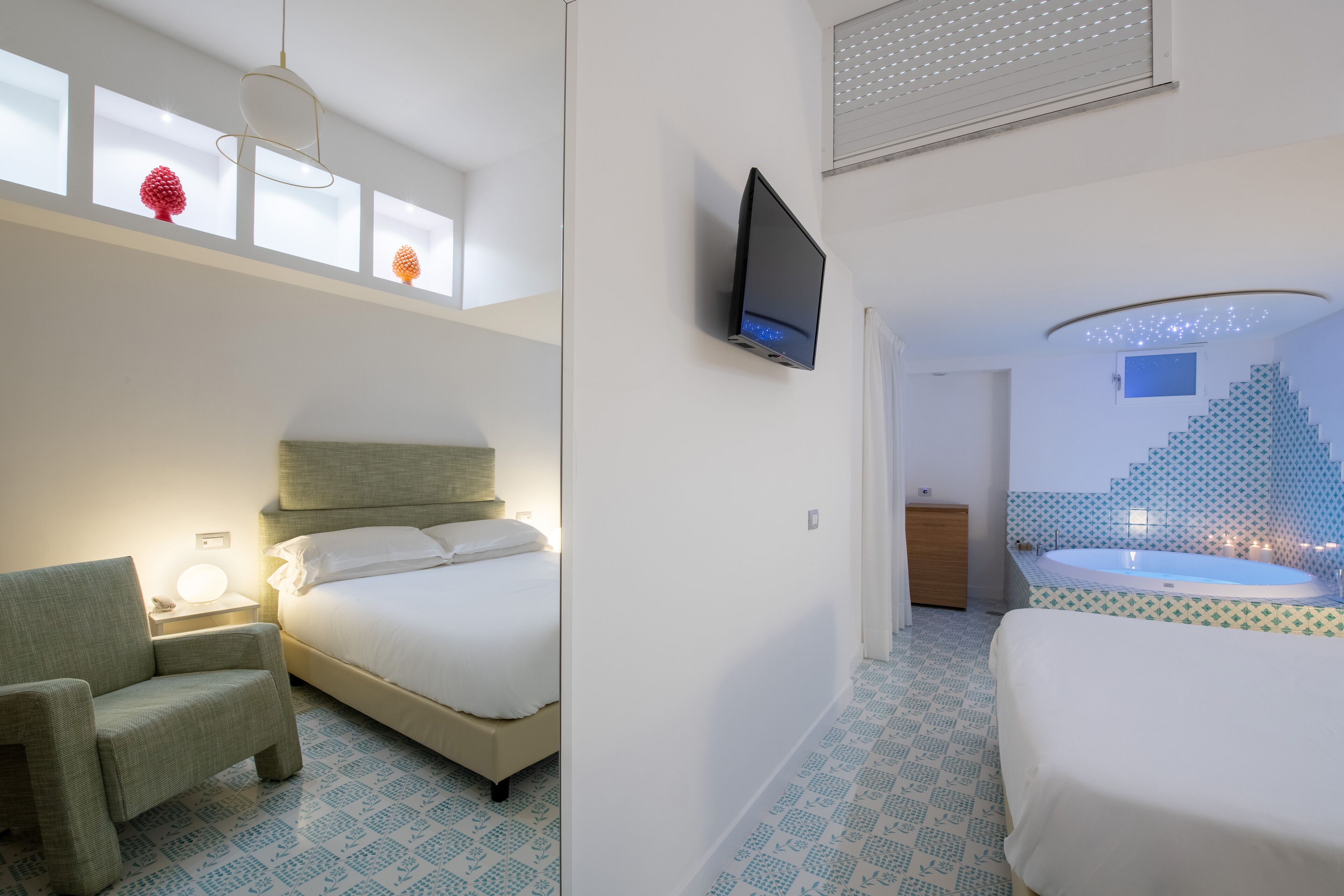 suite, hot tub (positano) | 1 bedroom, in-room safe, individually decorated, individually furnished