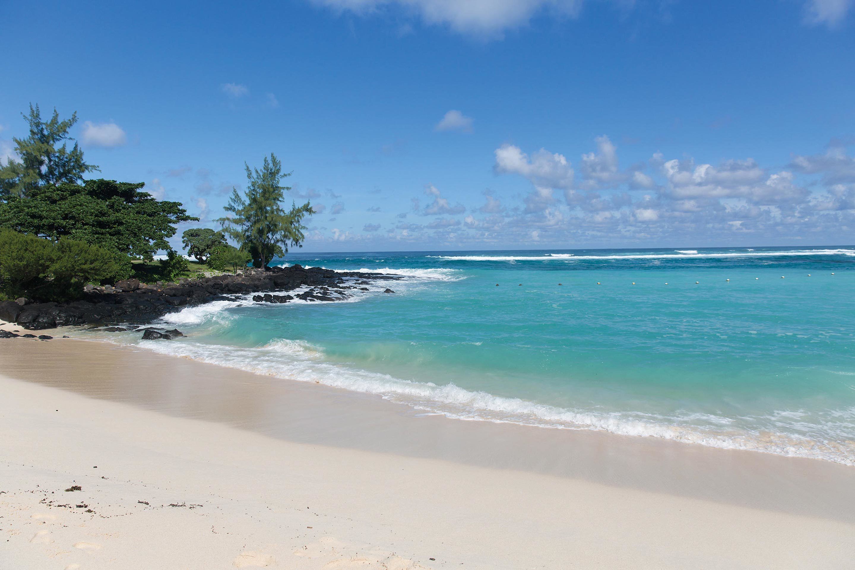on the beach, white sand, sun-loungers, beach umbrellas