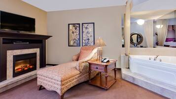Suite, 1 King Bed, Non Smoking (Hot Tub & Fireplace) | Desk, blackout drapes, iron/ironing board, free cribs/infant beds