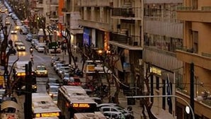 A street lined with multi-story buildings, featuring balconies and a mix of commercial and residential spaces. - Athens Moka Hotel (Athens)