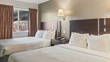 Suite, varias camas, para no fumadores | Escritorio, cortinas blackout, wifi gratis y ropa de cama