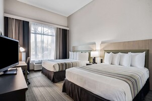 Premium bedding, pillowtop beds, desk, laptop workspace