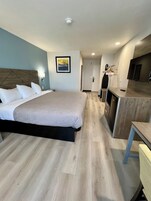 Desk, laptop workspace, blackout drapes, iron/ironing board