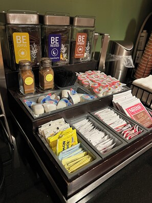 A breakfast buffet with various food items and beverages. - Sleep Inn & Suites Conference Center Eau Claire North (Eau Claire)