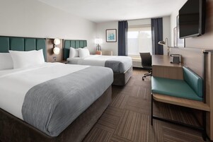 Hypo-allergenic bedding, desk, laptop workspace, blackout drapes