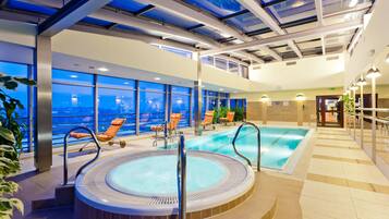 Indoor pool, open 7:00 AM to 10:00 PM, pool loungers