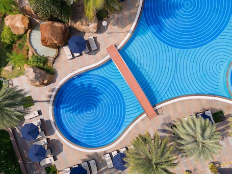 Outdoor pool. Novotel Hyderabad Convention Centre Hotel