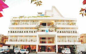 A multi-story hotel with balconies, a central entrance, and a parking area. - The Wall Street Beacon, Jaipur (Jaipur)