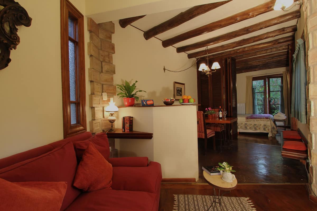 suite (liquidambar) | living area | 32-inch led tv with satellite channels, tv, books