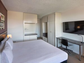 Deluxe Room, 1 Queen Bed, Balcony | In-room safe, desk, laptop workspace, blackout drapes