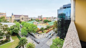 A cityscape with a mix of historic and modern buildings, a prominent church, and a modern glass building. - Mercure Perth On Hay (Perth)