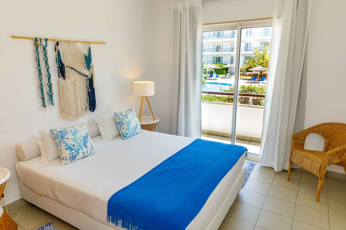 Standard Apartment, 2 Bedrooms, Pool View | 1 bedroom, in-room safe, blackout drapes, iron/ironing board