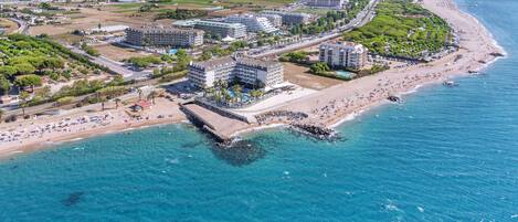 On the beach, sun loungers, beach umbrellas, beach bar